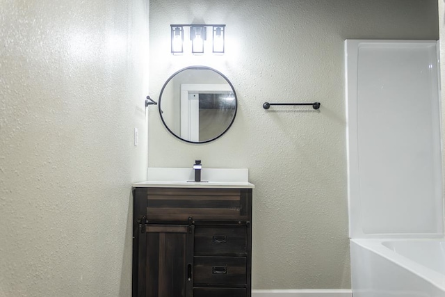 bathroom featuring vanity and a bathing tub