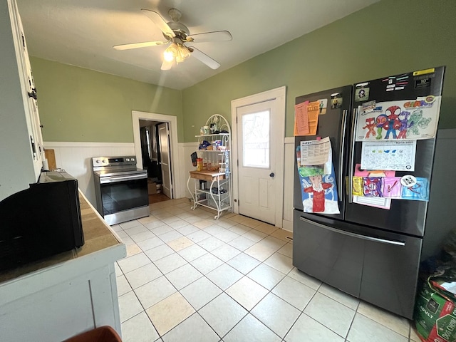 432 Woodrow, Chillicothe, MO 64601 - kitchen featuring a wainscoted wall, ceiling fan, stainless steel range with electric stovetop, and freestanding refrigerator