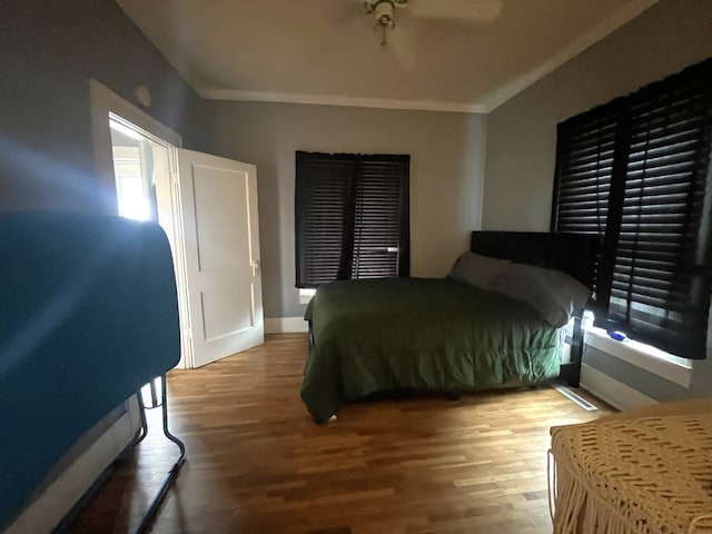 432 Woodrow, Chillicothe, MO 64601 - bedroom featuring ornamental molding, baseboards, ceiling fan, and wood finished floors