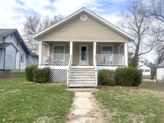 432 Woodrow, Chillicothe, MO 64601 - bungalow featuring a front yard and covered porch