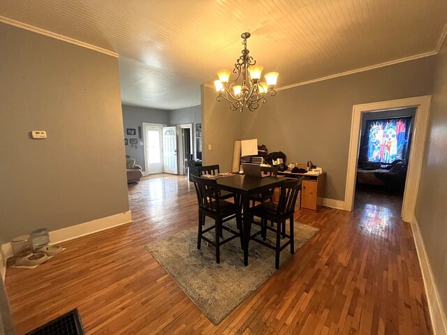 432 Woodrow, Chillicothe, MO 64601 - dining room featuring baseboards, ornamental molding, wood finished floors, and a chandelier