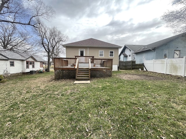 432 Woodrow, Chillicothe, MO 64601 - rear view of property with roof with shingles, a deck, a fenced backyard, central AC unit, and a lawn