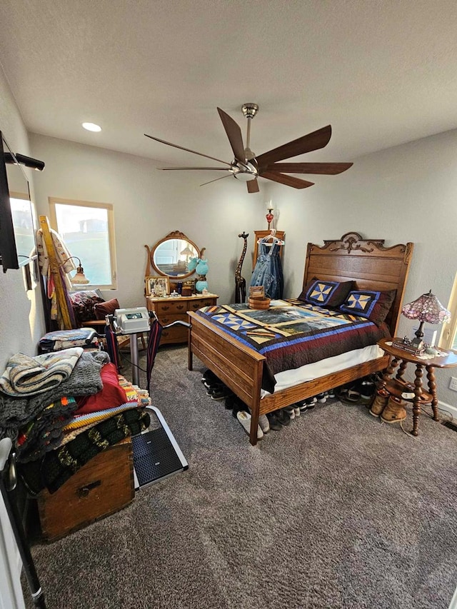 bedroom with carpet flooring, a textured ceiling, and ceiling fan