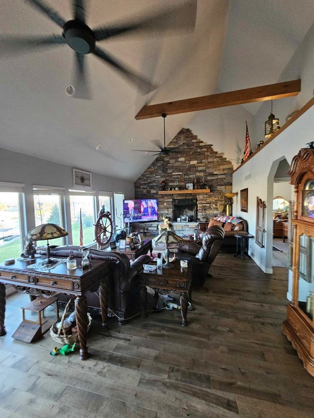 dining area featuring dark wood-type flooring, high vaulted ceiling, ceiling fan, a fireplace, and beam ceiling