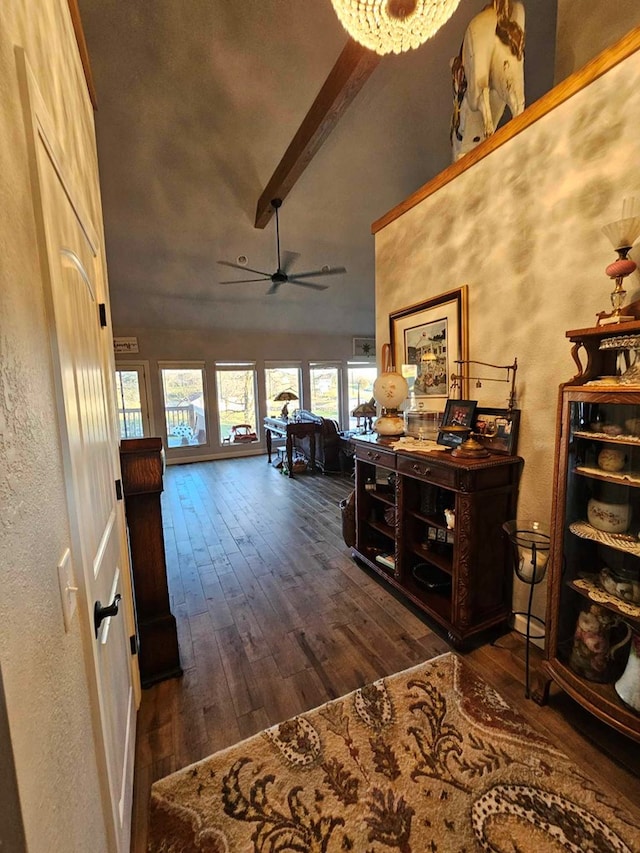 hall featuring beam ceiling, dark hardwood / wood-style flooring, high vaulted ceiling, and a chandelier