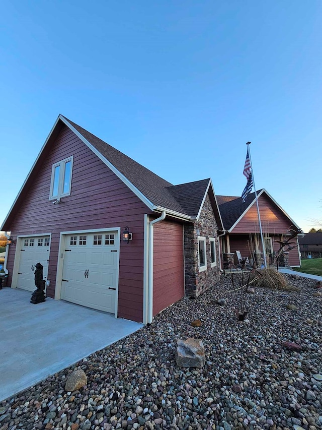 view of property exterior featuring a garage