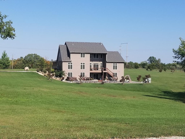 rear view of house with a yard