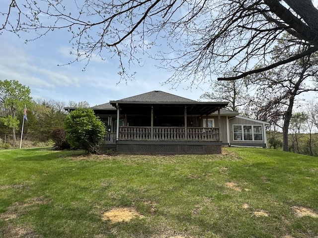 53895 E 3rd St, Milan, MO 63556 - rear view of house featuring a lawn and a wooden deck