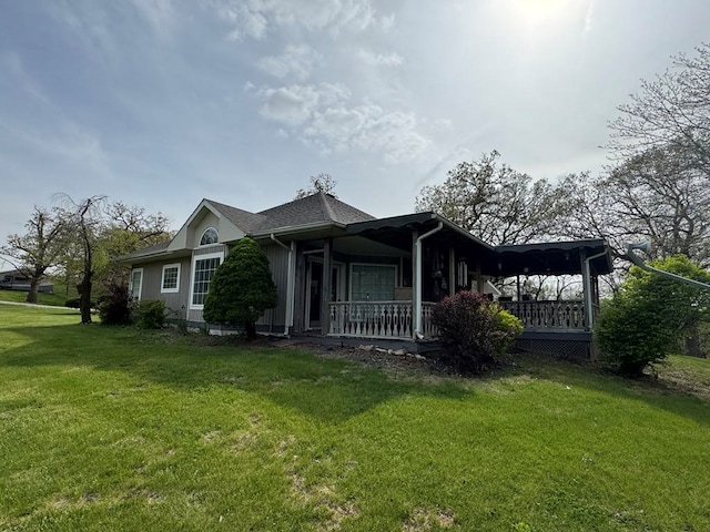 53895 E 3rd St, Milan, MO 63556 - view of side of property featuring a yard and a porch