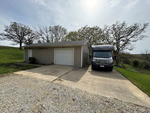53895 E 3rd St, Milan, MO 63556 - garage with driveway