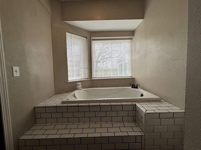 53895 E 3rd St, Milan, MO 63556 - full bathroom featuring a bath and a textured wall