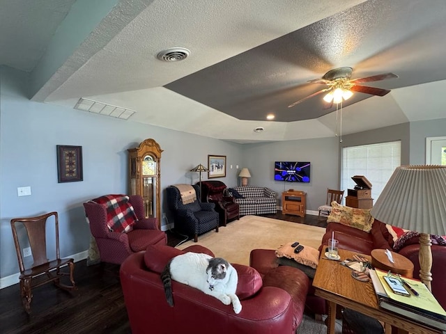 53895 E 3rd St, Milan, MO 63556 - living room with baseboards, visible vents, wood finished floors, and a ceiling fan