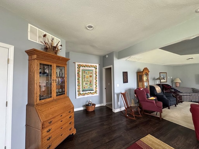 53895 E 3rd St, Milan, MO 63556 - living area featuring baseboards, wood finished floors, and a textured ceiling