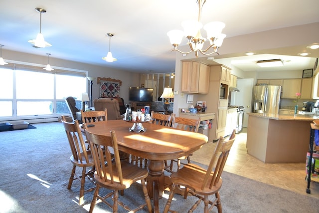 carpeted dining area with a notable chandelier and sink