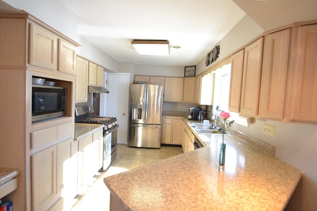 kitchen featuring kitchen peninsula, stainless steel appliances, light brown cabinetry, and sink