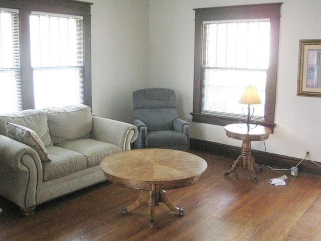 living area with hardwood / wood-style flooring