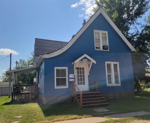410 E Buchanan, Kirksville, MO 63501 - bungalow-style house with a chimney, a front lawn, and a shingled roof