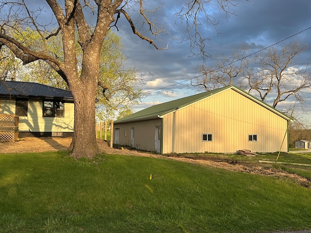 exterior space with an outbuilding and a yard