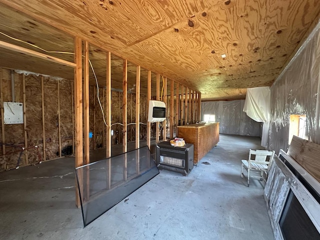 interior space featuring concrete floors and heating unit