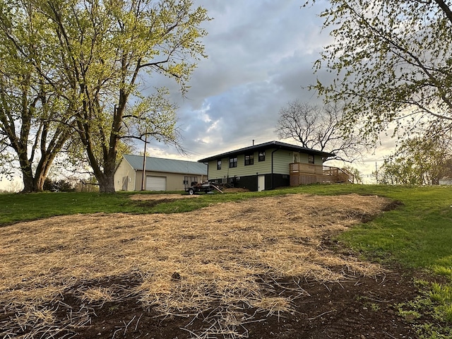 rear view of property with a garage