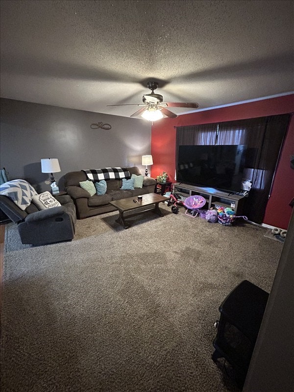 116 Adams St, Centralia, MO 65240 - living area with carpet floors, a ceiling fan, and a textured ceiling