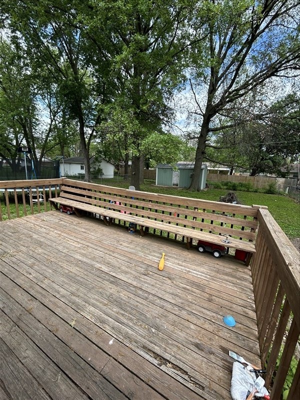 116 Adams St, Centralia, MO 65240 - wooden deck featuring a shed and an outdoor structure