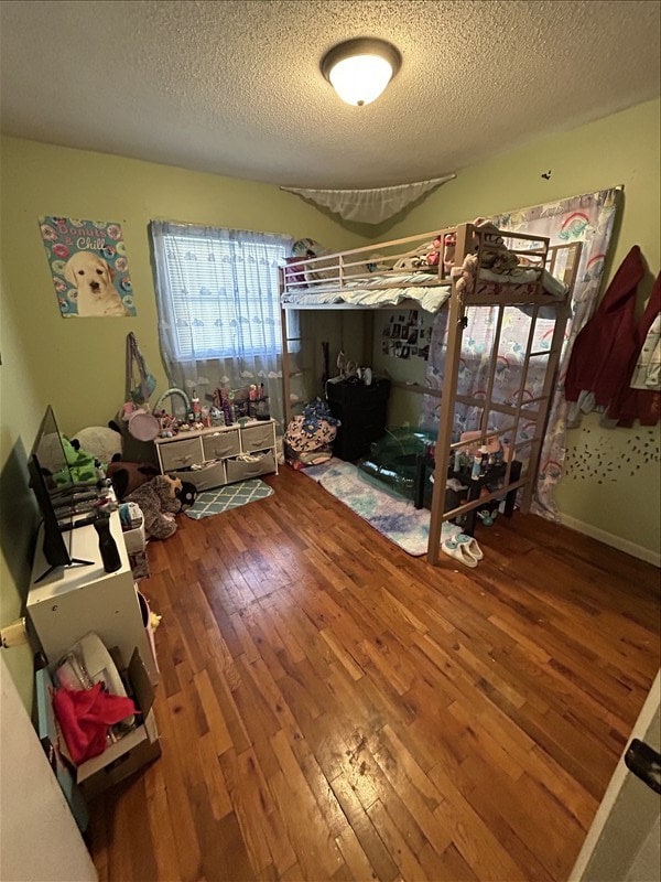 116 Adams St, Centralia, MO 65240 - bedroom featuring hardwood / wood-style flooring and a textured ceiling