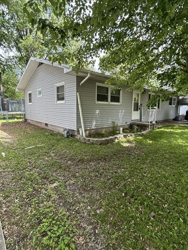 116 Adams St, Centralia, MO 65240 - view of property exterior featuring a trampoline and crawl space