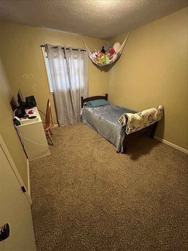 116 Adams St, Centralia, MO 65240 - bedroom with a textured ceiling and carpet