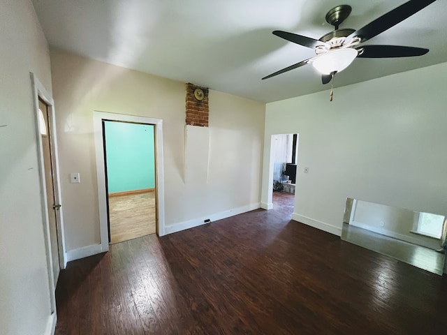 unfurnished room featuring ceiling fan and dark hardwood / wood-style flooring