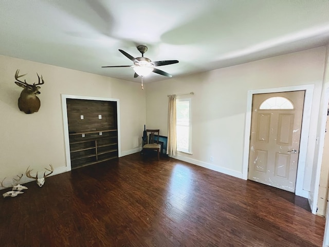 interior space featuring ceiling fan and dark hardwood / wood-style flooring