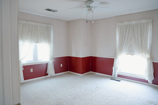 carpeted empty room with ceiling fan