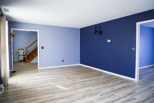 spare room with light hardwood / wood-style floors