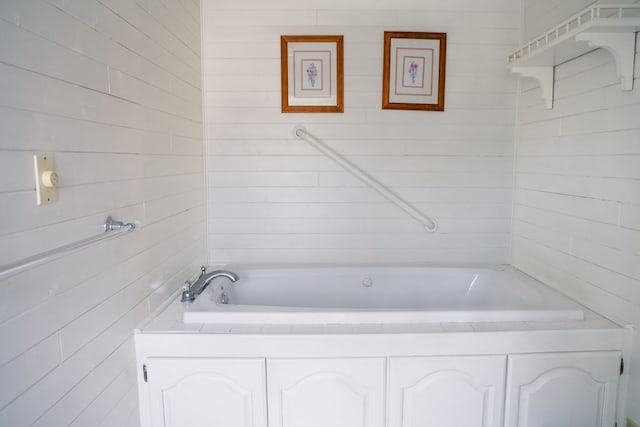 bathroom with a washtub