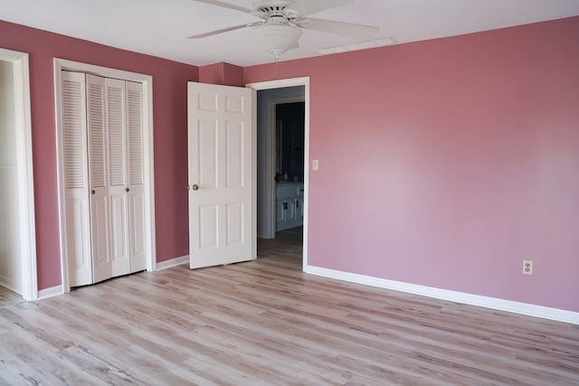 unfurnished bedroom featuring ceiling fan, light hardwood / wood-style flooring, and a closet