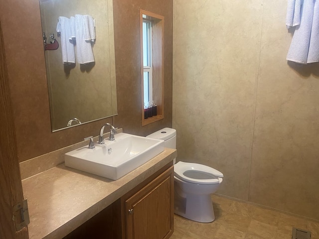 302 Mead St, Utica, MO 64686 - bathroom with toilet, vanity, and visible vents