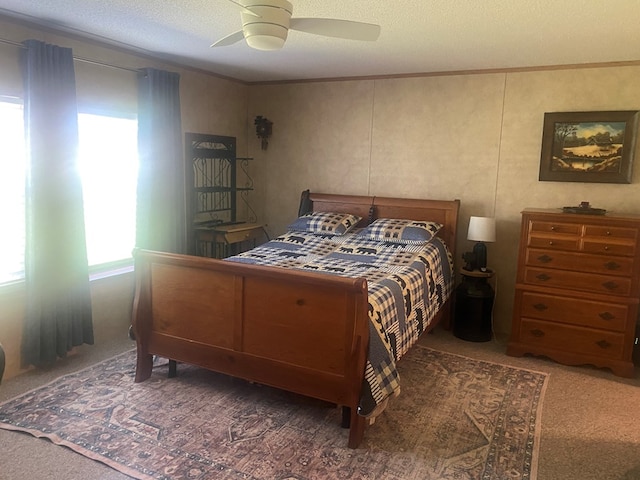 302 Mead St, Utica, MO 64686 - bedroom featuring a ceiling fan, a textured ceiling, ornamental molding, and carpet