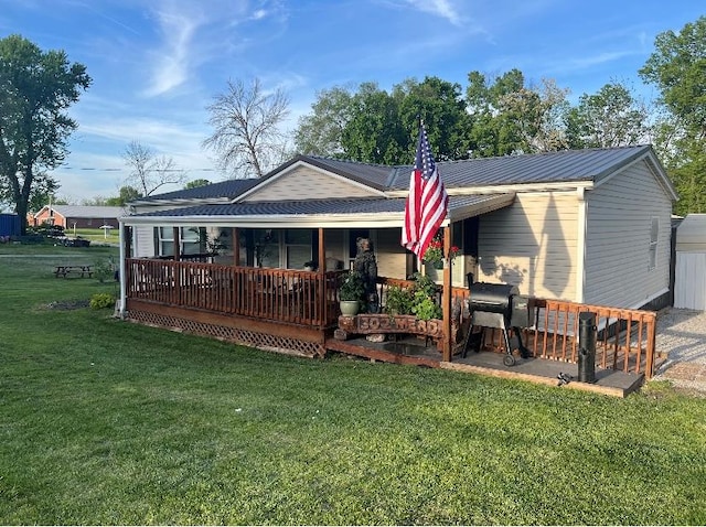 302 Mead St, Utica, MO 64686 - back of house featuring a porch and a lawn