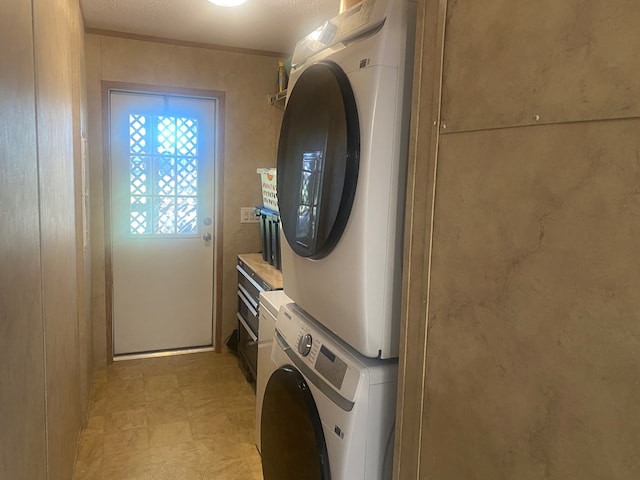 302 Mead St, Utica, MO 64686 - laundry area featuring stacked washer / dryer, laundry area, and light floors