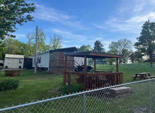 302 Mead St, Utica, MO 64686 - view of yard featuring a storage shed, an outdoor structure, and fence