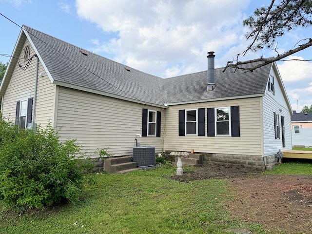 120 W Caldwell St, La Plata, MO 63549 - back of property featuring roof with shingles and a lawn