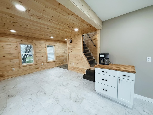 120 W Caldwell St, La Plata, MO 63549 - bonus room with recessed lighting, stairs, wooden walls, light marble finish flooring, and wooden ceiling