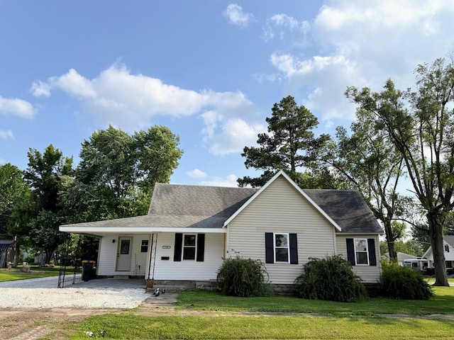 120 W Caldwell St, La Plata, MO 63549 - view of front of property with a front lawn and roof with shingles