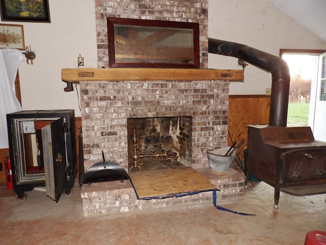 room details with a fireplace and wooden walls