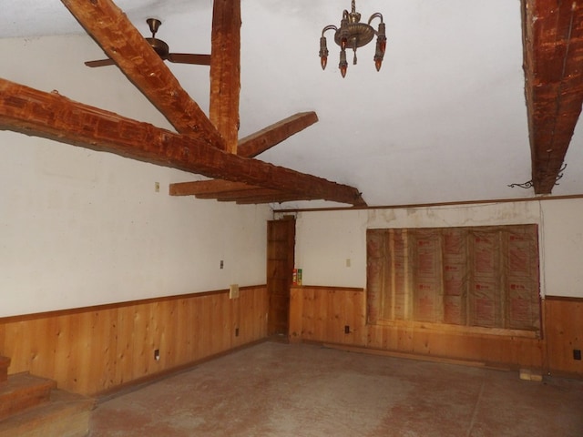 unfurnished room featuring lofted ceiling