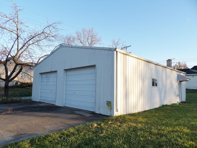 garage featuring a yard