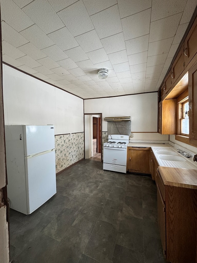 kitchen with sink and white appliances