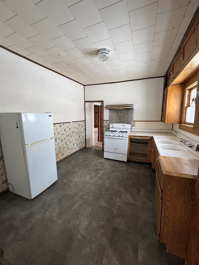 kitchen featuring sink and white appliances