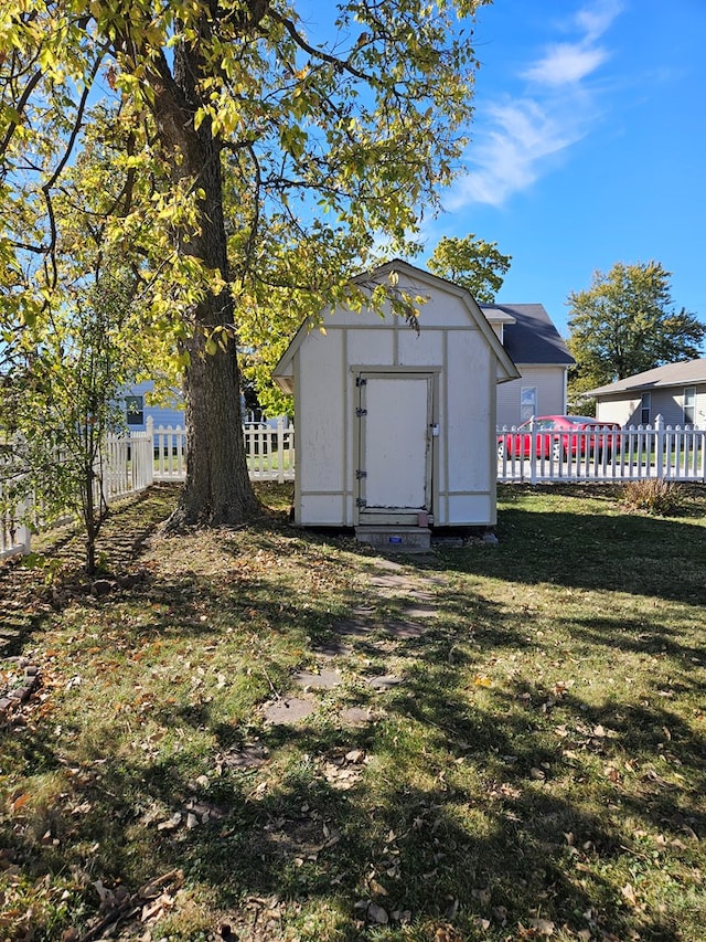 view of outbuilding featuring a yard