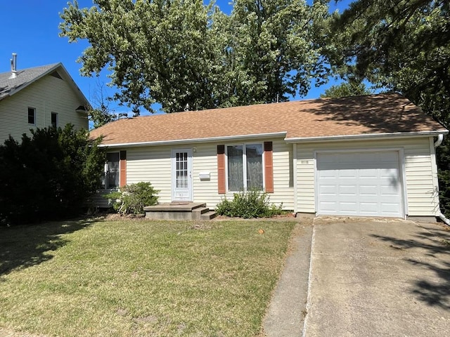 view of front facade featuring a front yard and a garage